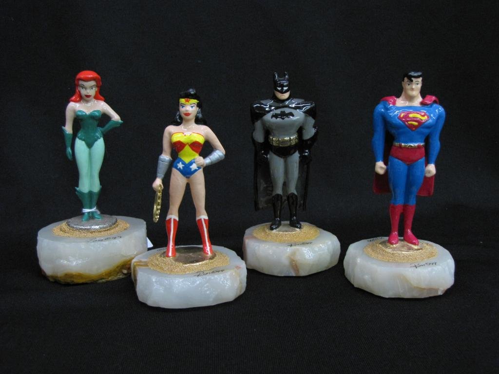 Four Ron Lee Superfriends Sculptures: Four Ron Lee Superfriends sculptures, including Poison Ivy, 97, 241/1250; Wonder Woman, 99, 1489/2500; Batman, 99, 1695/2500; and Superman, 99, 85/2500; each on alabaster base, with cast metal figures