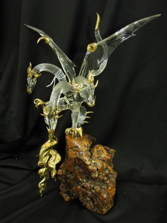 James Lawrence Blown Glass Sculpture, Dragon: James Lawrence (Nashville, IN, Active), blown glass sculpture depicting three headed dragon, with brass accents, on composition landscape base, signed, 16" overall height