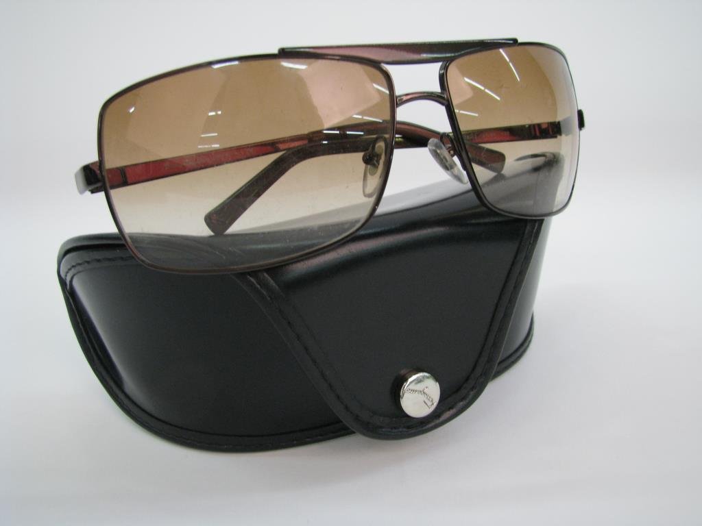 Salvatore Ferragamo Brown Frame Sunglasses: Salvatore Ferragamo brown metallic frame sunglasses in original case. Brown gradient rectangular shape wrap style lenses. Unisex design. Style 1134 578/13