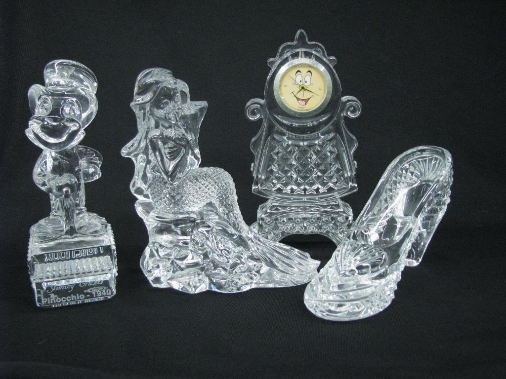 Four Waterford Crystal Disney Figures: Four Waterford crystal Disney figures including glass slipper, Jiminy Cricket, Ariel, and Beauty and the Beast clock