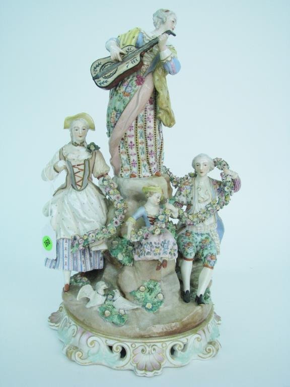 Large Meissen Porcelain Figural Grouping: A large, Meissen Porcelain, figural grouping, with cross swords mark, 16" high, depicting five figures with garland and birds, one figure with missing hand
