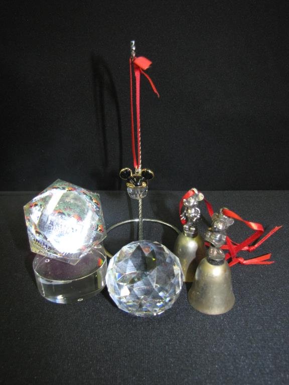 Group of Disney Collectibles: Group of Disney collectibles, including two Arribas paperweights, two figural bell ornaments, and one Mickey Mouse jeweled ornament