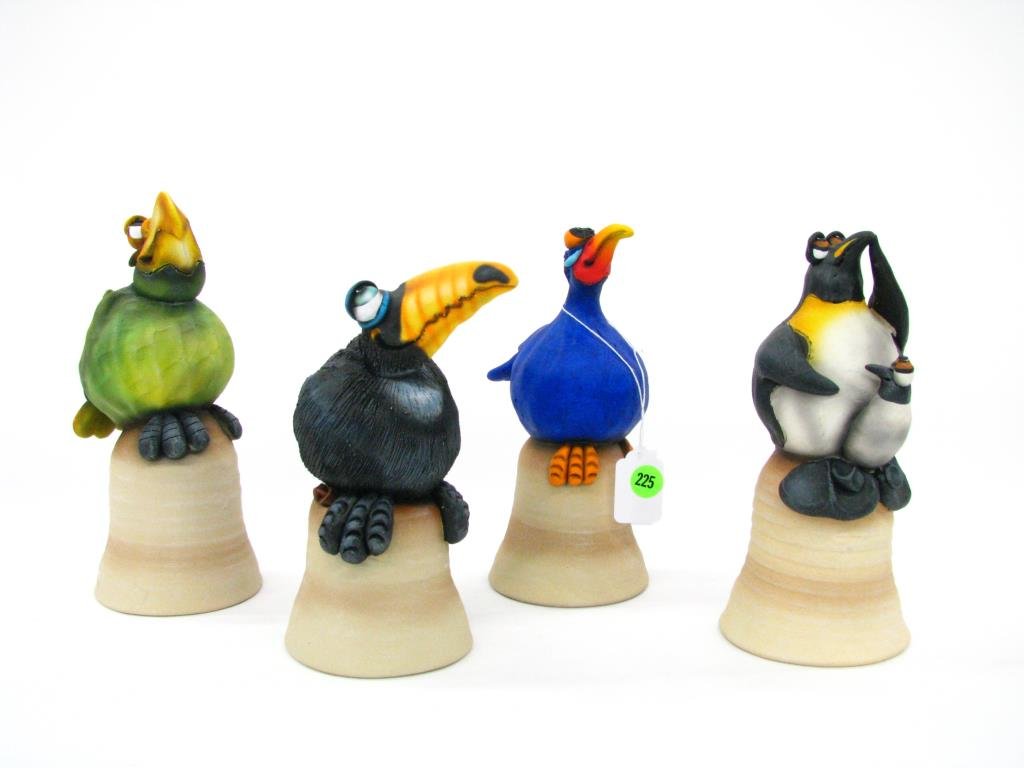 Todd Warner Dinner Bell Sculptures: Group of four Todd Warner Dinner Bell Sculptures including Penguin, Toucan, Parrot, and Bluebird (with damaged wing tip), 7" to 8" high, each pencil signed and dated between 1998 to 2000