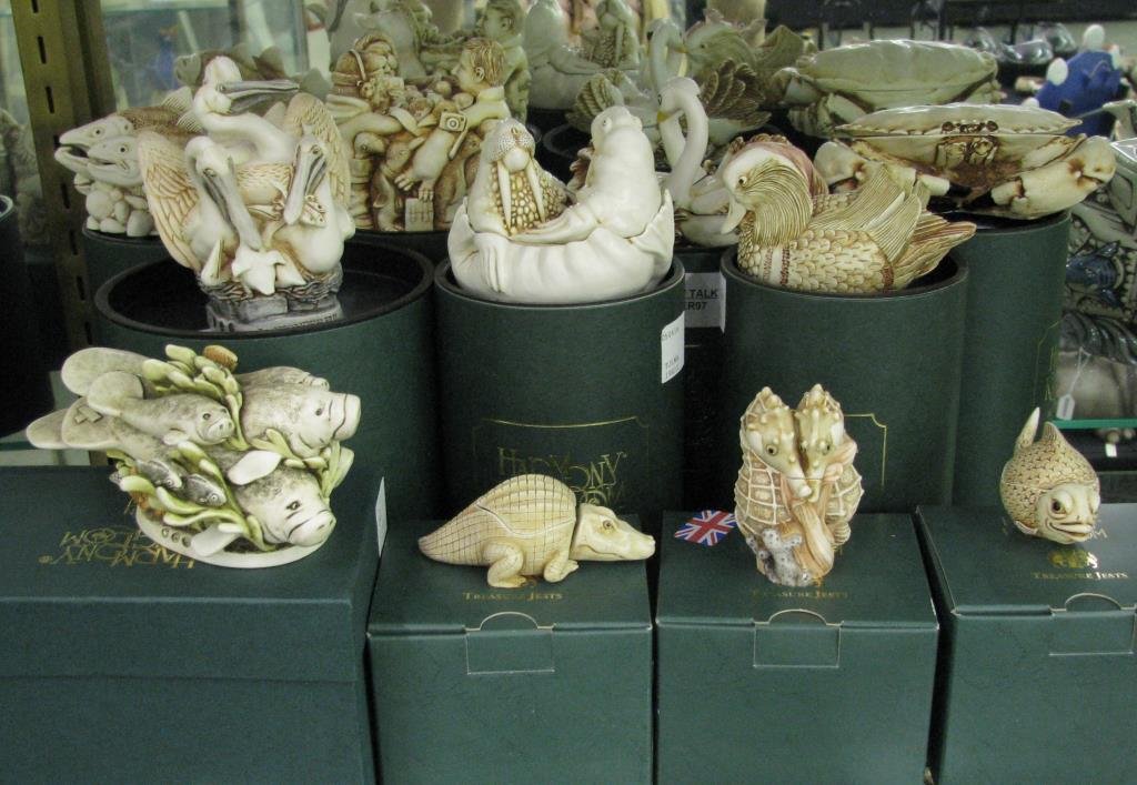 Group of Harmony Kingdom Figurines: A group eleven of Harmony Kingdom figurines including "Pillow Talk"; "Antarctic Antics"; "Step Aside"; "Pell Mell"; "Journey Home"; "Drake's Fancy"; "Tea for Two"; "Crack a Smile"; "Always and Forever