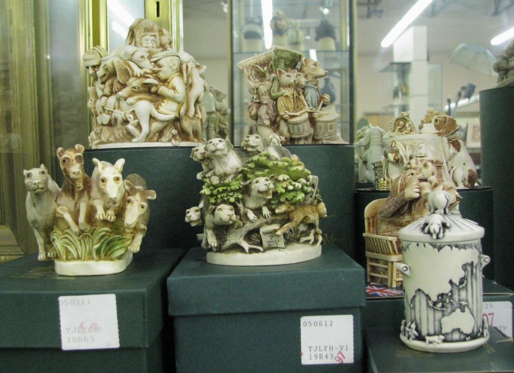 Group of Harmony Kingdom Figurines: A group of seven Harmony Kingdom Figurines including "Planet Dustbin"; "Earl Cadogan's Tea Party"; "Retired Racers", 2598/5000; "Tally Ho!"; "Swan 'n Sell"; "Lord of the Aisles"; "Mad Dogs and English