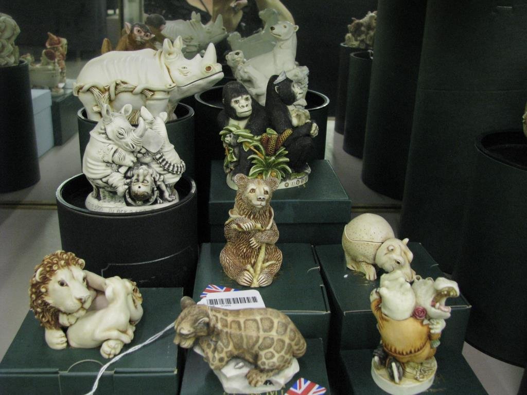 Group of Harmony Kingdom Figurines: A group of ten Harmony Kingdom figurines including "Koko's Treat"; "Play Ball", 5524/7200; "Queen of the Jungle"; "Trouble Bruin"; "Horn a' Plenty"; "Nose Bleed", 3548/5000; "Sweet Spot"; "In te Know"