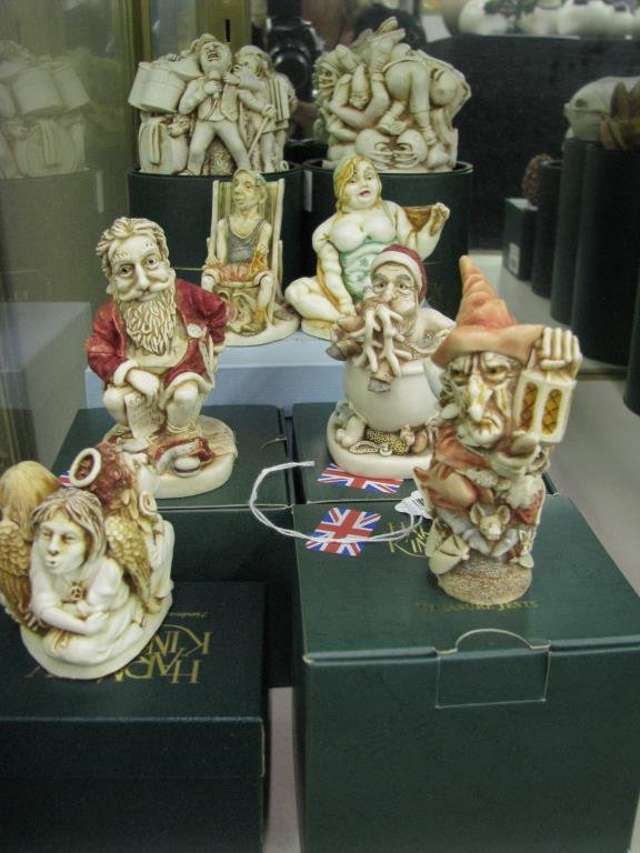 Group of Harmony Kingdom Figurines: A group of seven Harmony Kingdom Figurines including "Holy Water"; "Paradise Found"; "Witching Time"; "Holy Sit"; "Hold that Line"; "Open Mike"; "Queenie and Prince Charming", A/P;