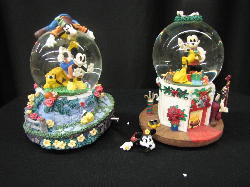 Two Disney Snow Globes: Two Disney Snow Globes including: Globe with Mickey, Donald, Minnie, Pluto, Goofy (Damaged, without original Box) and Globe with Mickey and Pluto (with original Box) 8" tall (First Globe: Minnie is br