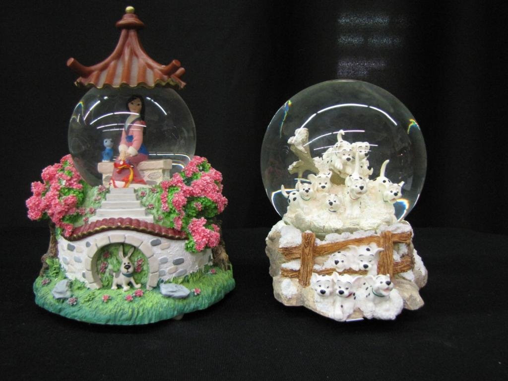 Two Disney Snow Globes: Two Disney Snow Globes including: One depicting scene from Mulan, One depicting Scene from 101 Dalmatians, 6-8" tall, with original boxes