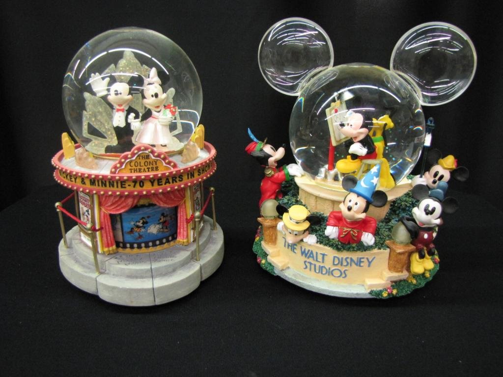 Two Disney Snow Globes: Two Disney Snow Globes depicting Mickey and Minnie at the Colony Theatre celebrating 70 years in show business (with original box) and Mickey and Pluto at Walt Disney Studios (without original box), 8