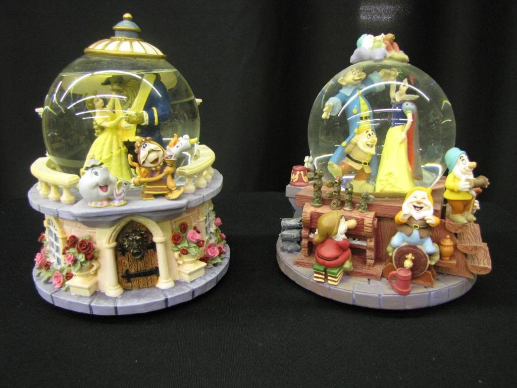 Two Disney Snow Globes: Two Disney Snow Globes depicting Beauty and the Beast (with original box) and Snow White and the Seven Dwarves (without original box) 8" tall each