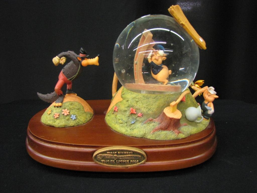 Disney Snow Globe: Disney Snow Globe depicting scene form the 3 Little Pigs, 3" tall, with original box (item missing from top of straw house roof)