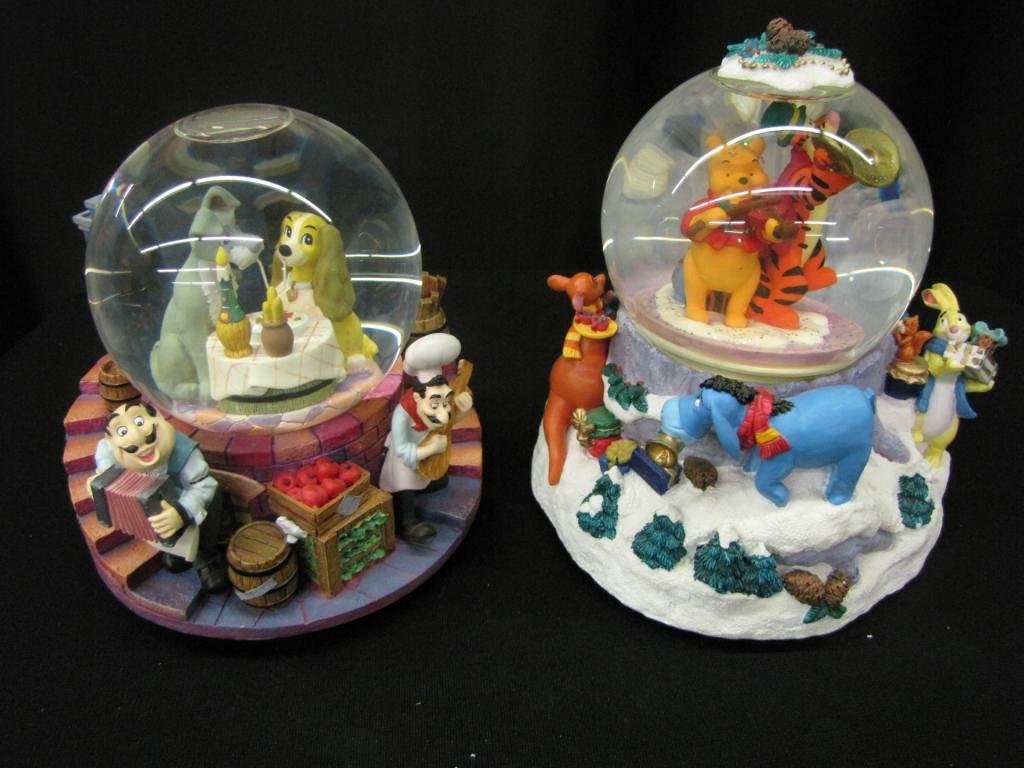 Two Disney Snow Globes: Two Disney Snow Globes depicting Pooh characters and Spaghetti scene from Lady and the Tramp, 7-8" tall, with original boxes