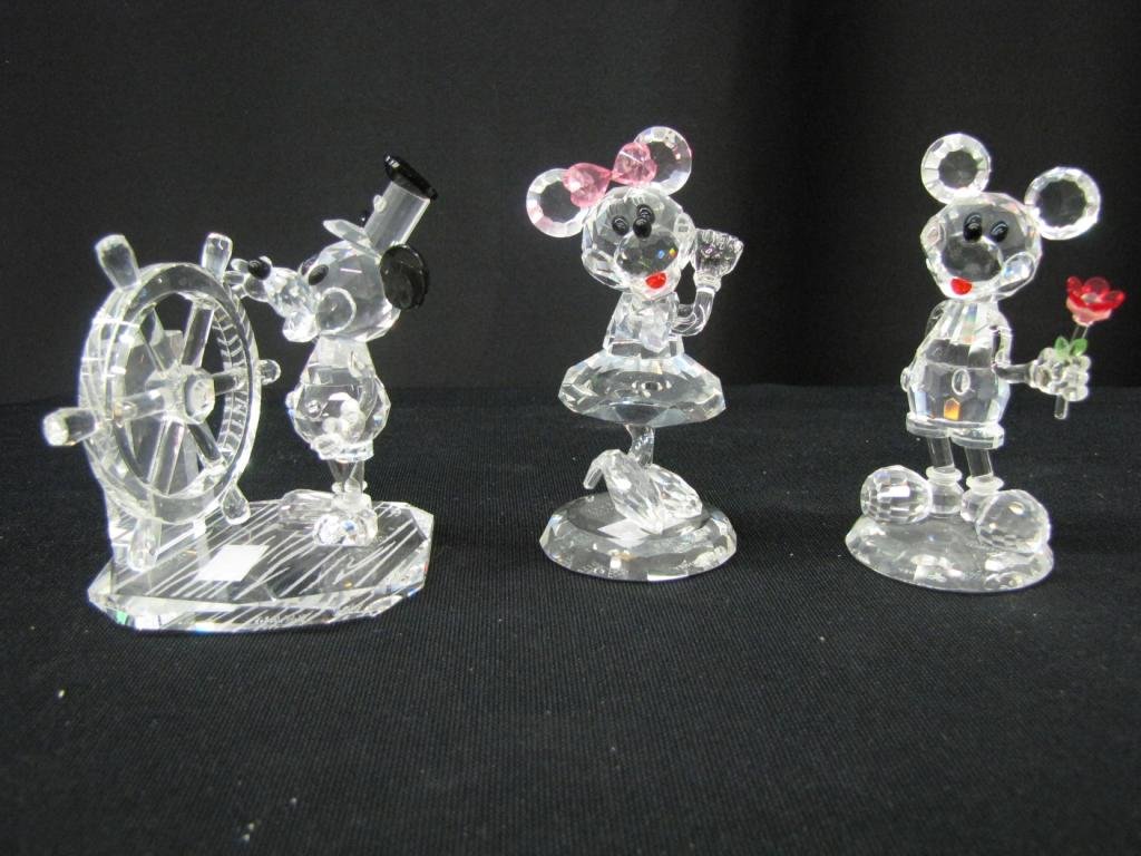 Three Crystal World Disney Figurines: Three Disney Crystal Figurines Depicting Steamboat Willie with ship wheel, Mickey mouse with roses, and Minnie mouse, 4" tall, with original boxes