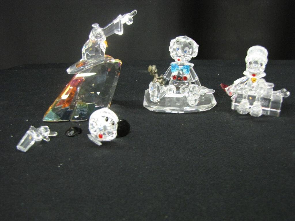 Three Disney Crystal World Figurines: Three Disney Crystal World Figurines depicting Mickey as the Sorcerer's apprentice, Jiminy Cricket, Pinocchio with cricket. 3-4" tall, with original boxes (Mickey broken in multiple places, all pieces