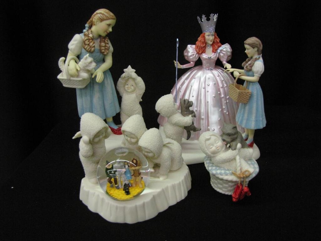 Four Porcelain Snowbabies Figural Groupings: Group of Porcelain Snowbabies Figural Groupings depicting Galinda, Dorothy, jewelry box, and snow globe, 4-9" tall, with original boxes (Galinda has piece broken off of crown (included))