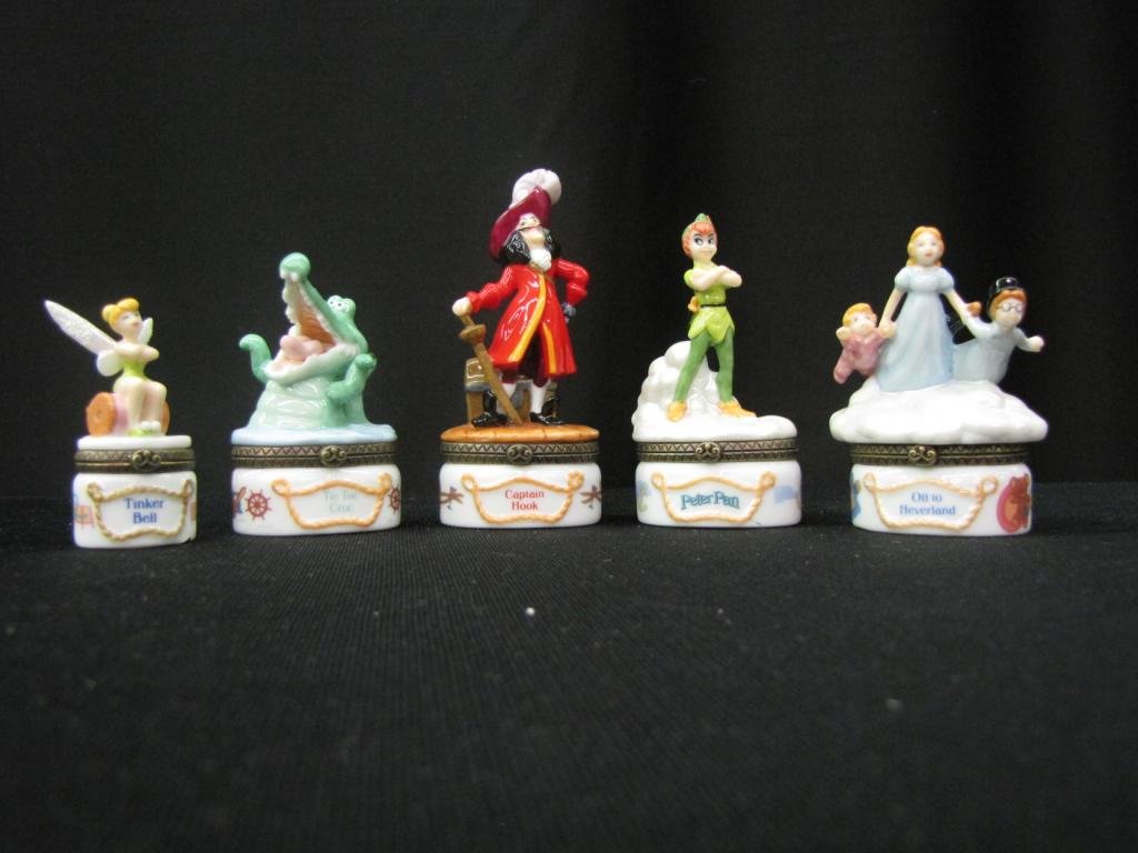 Set of Five Disney Porcelain Hinged Boxes: Set of Five Disney Porcelain Hinged Boxes Depicting Various characters from Peter Pan, 2-4" tall, without original boxes