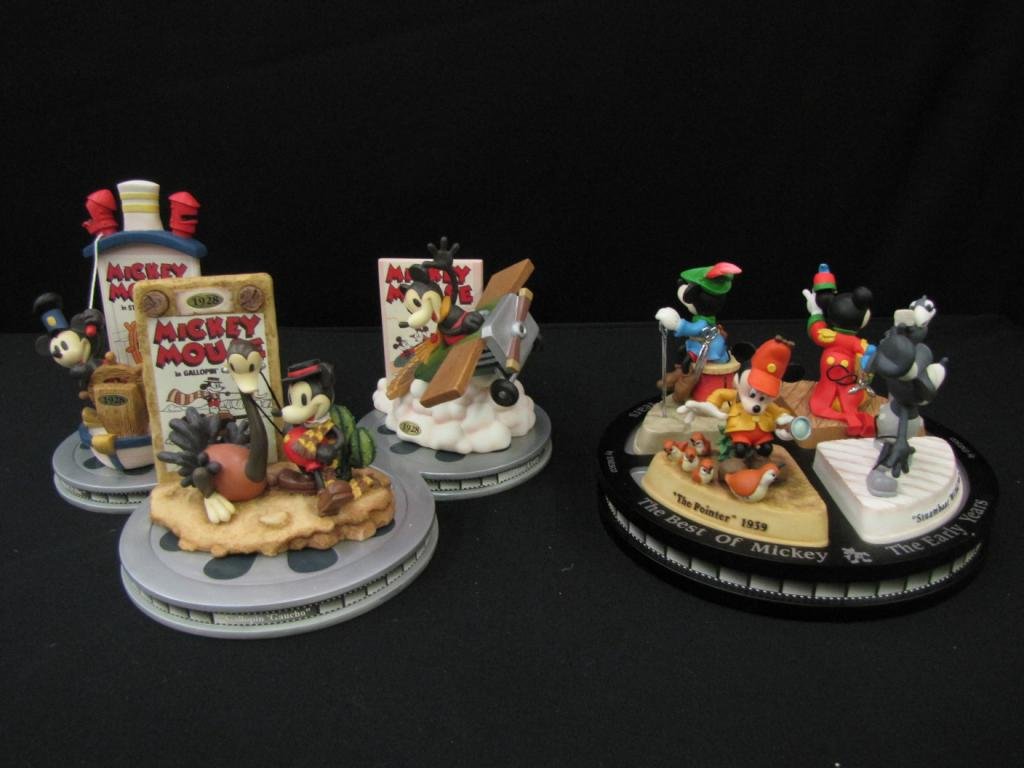 Two Porcelain Disney Figural Groupings: Two Porcelain Disney Figural Groupings including: one set featuring "Plane Crazy", "Gallopin Gaucho", "Steamboat Willie" and the other featuring "Steamboat Willie", "The Band Concert", "Brave Little T