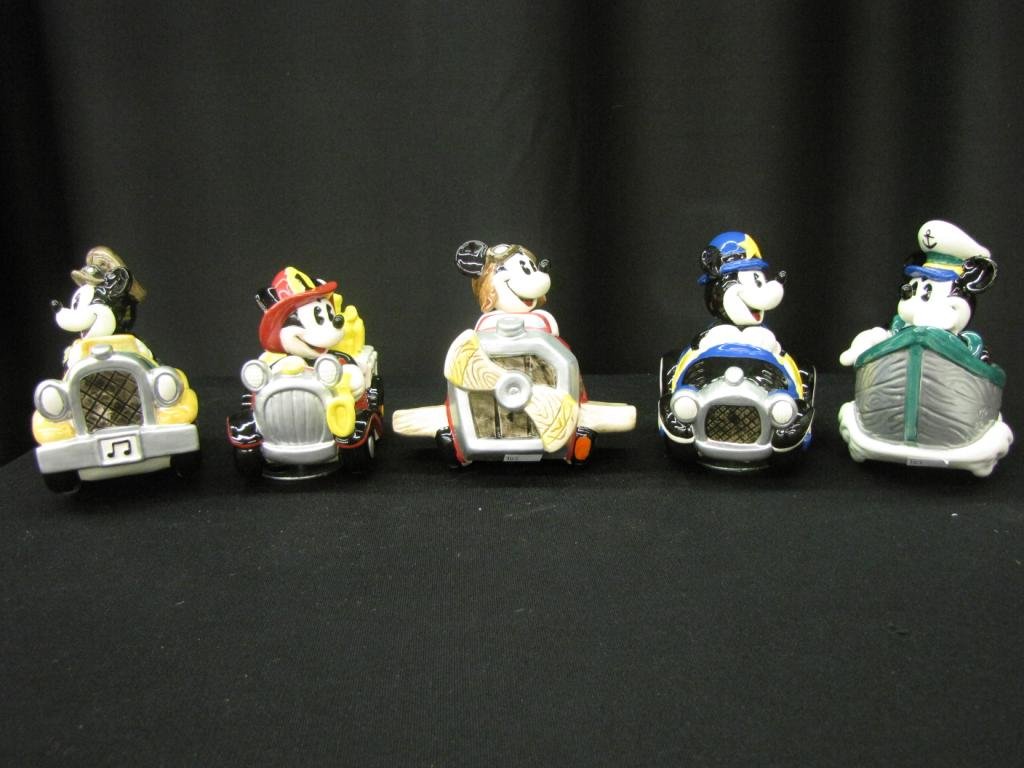 Five Enesco Porcelain Mickey Music Boxes: Five Enesco Porcelain Mickey Music boxes including: Mickey in a plane, boat, police car, fire engine, and automobile, 5" tall, with original boxes