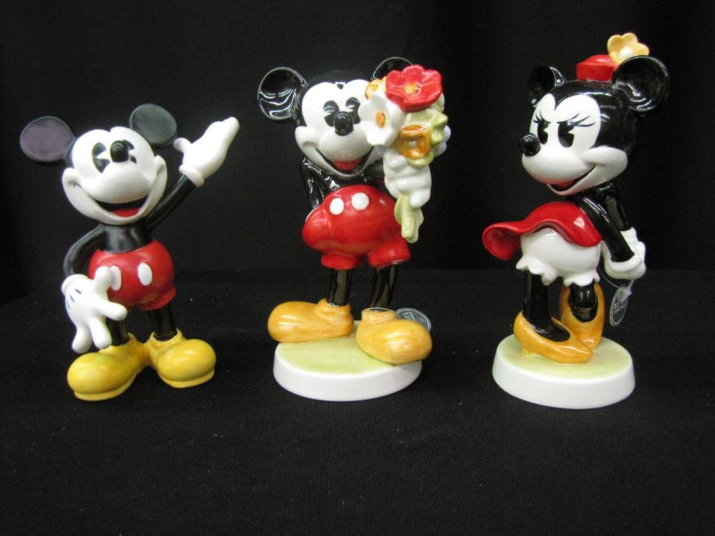 Three Porcelain Disney Figurines: Three Porcelain Disney Figurines including two Mickey Mouse and one Minnie mouse, 6-7" tall, without original boxes