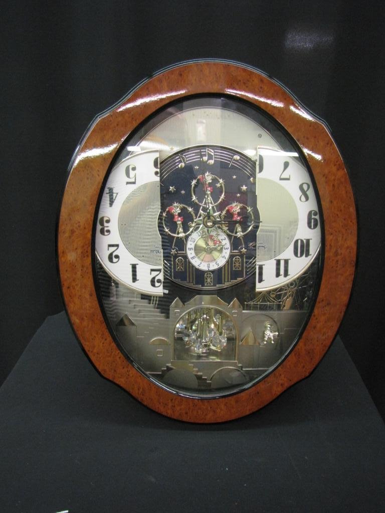 Disney Small World Rhythm Clock: Rhythm wall Clock, Disney "Small World" Theme, with revolving clock face and pendulum, 20" tall