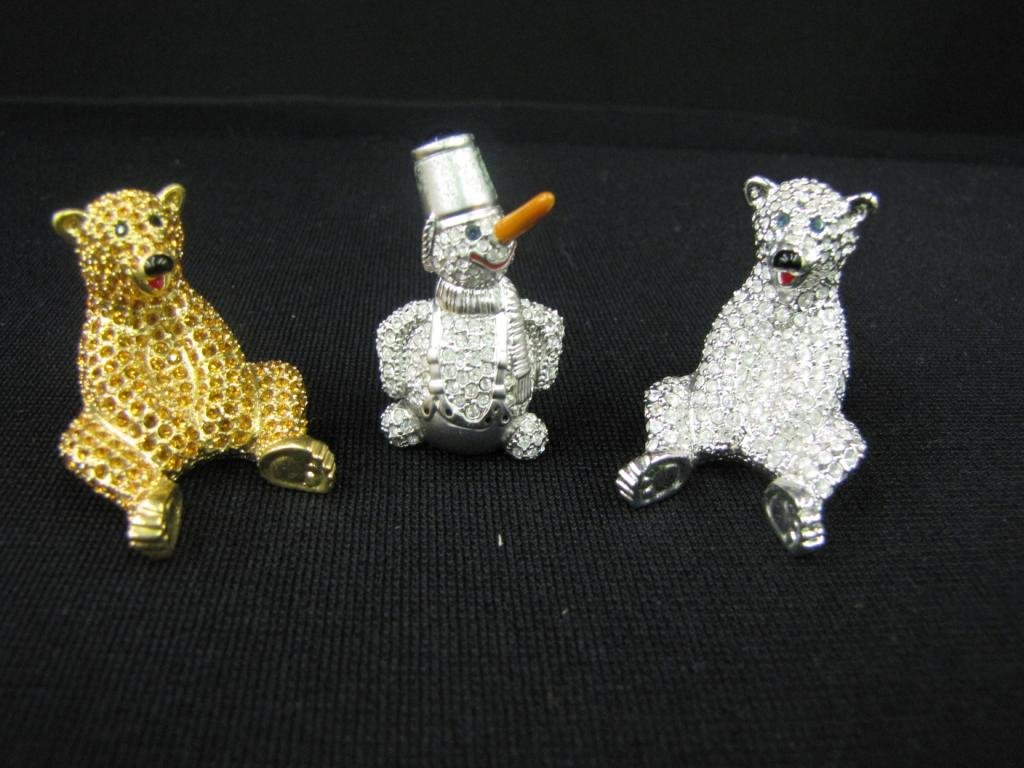 Three Oliver Weber Swarovski Crystal Figurines: Three Oliver Weber Arribas Bros. Swarovski Crystal Figurines including: Brown Bear, Polar Bear, and Snowman, 1-2" tall, all with original boxes except for snowman