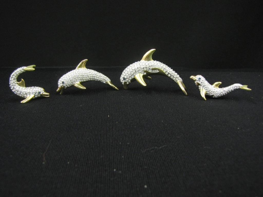 Four Oliver Weber Swarovski Crystal Figurines: Three Oliver Weber Swarovski Crystal Figurines, full set, with scenic stand, including: Dolphin father, mother, boy, and girl, 1-2" tall, with original boxes