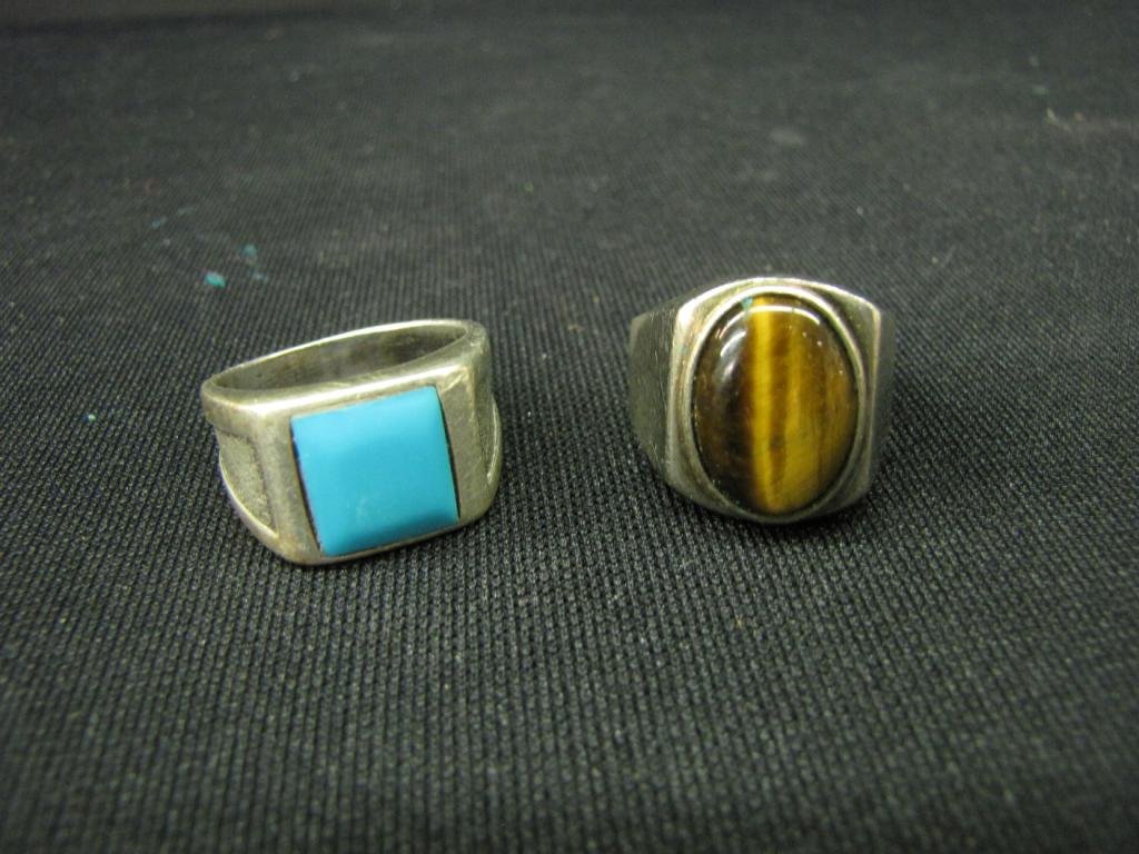 Two Gents Rings, Turquoise, Cat's Eye: Two Gent's rings, including one stainless steel ring with large cat's eye stone and one ring, unmarked, with large turquoise stone