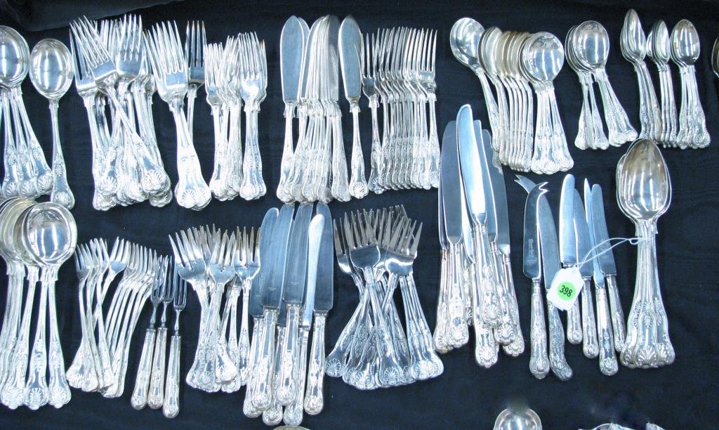 Large Group of Shell Motif Silver Plate Flatware: Large group of shell motif silver plate flatware, all similarly designed, some contemporary, some antique, includes dinner forks, salad forks, luncheon forks, pie forks, table knives, butter and chees