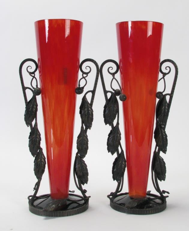 Pair of French Glass Vases: A pair of red glass vases, signed France, possibly Daum?, in iron art deco holders, small repair on rim of one vase, 16" tall each