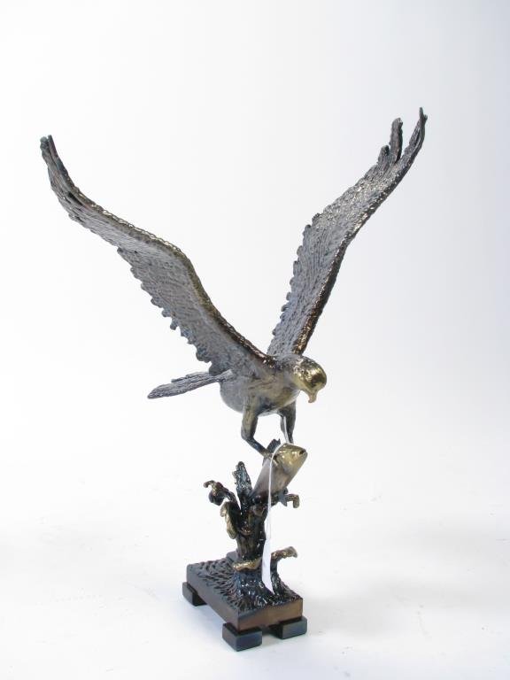 Signed Byron Wood Steel Sculpture: A signed, steel hawk sculpture, on aluminum base, depicting a hawk hunting fish, signed on base Byron M. Wood, 2014, 17.75" high, bronze finish