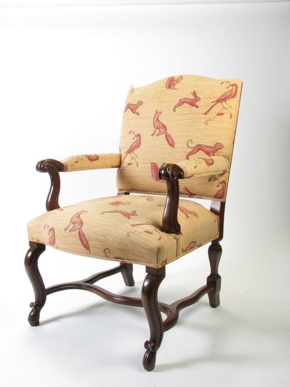 Pair of William Switzer Upholstered Arm Chairs: William Switzer decorator upholstered arm chairs, with woodland creature upholstery, period style mahogany frames, stretcher base, carved arms, 42h x 29 x 32