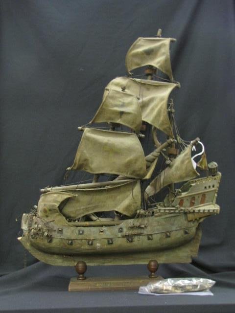 Harry Davis Model of Spanish Galleon: A wooden ship model depicting a Spanish Galleon, assembled by Indiana artist Harry A Davis (IN, 1914-2006), some missing and/or broken pieces, in wood display stand, 24 inches high