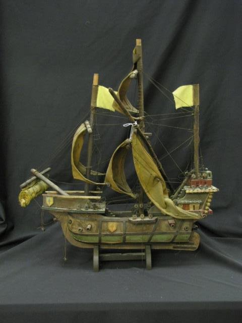 Harry Davis, Wooden Model of Santa Maria: A wooden ship model of Columbus' Santa Maria, assembled by hand by Indiana artist Harry A Davis (IN, 1914-2006) when he was 13 years old, some missing and/or broken pieces, wood display stand, 24 inch