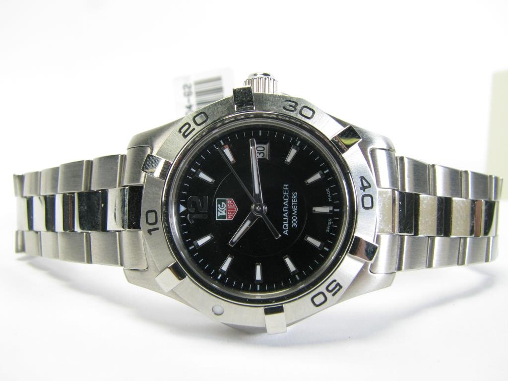 Lady's Stainless Tag Heuer Aquaracer Watch: A lady's stainless steel Tag Heuer Aquaracer watch with black dial
