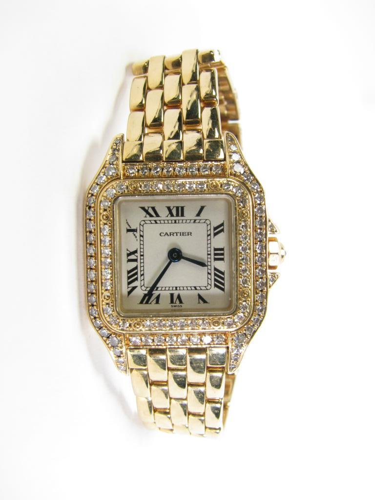 Lady's 18K Yellow Gold Cartier Panthere Watch: A lady's 18K yellow gold Cartier Panthere watch with full diamond bezel