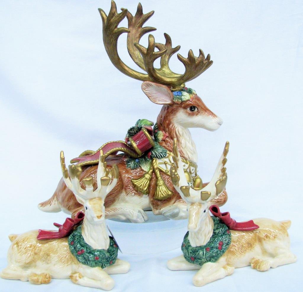 Fitz and Floyd Christmas Motif Pottery: Fitz and Floyd Christmas motif pottery, three pieces total, including decorative reindeer, 13" tall, and set of two reindeer candle holders