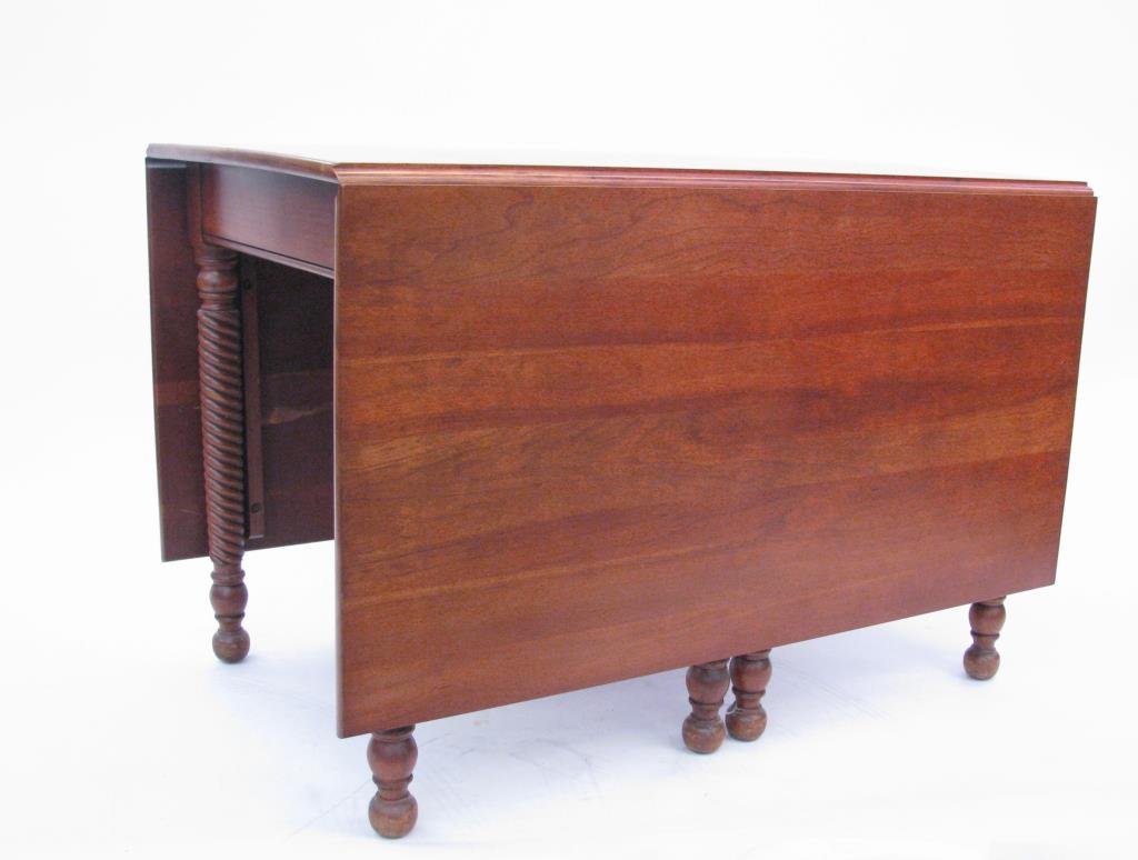 Antique Cherry Double Drop Leaf Table: Antique Cherry double drop leaf table, with rope twist motif legs and gatelegs, (sun-bleached top)