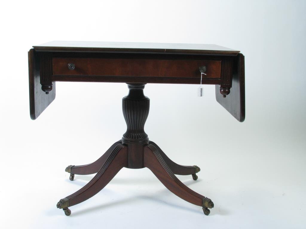 Vintage Charak Mahogany Console Table: A vintage mahogany console table with one drawer, drop leaf extensions, Duncan Phyfe style base on caster wheels, tag inside drawer Charak Furniture, Boston, 34w x 20 x 28.5h (leaves down)