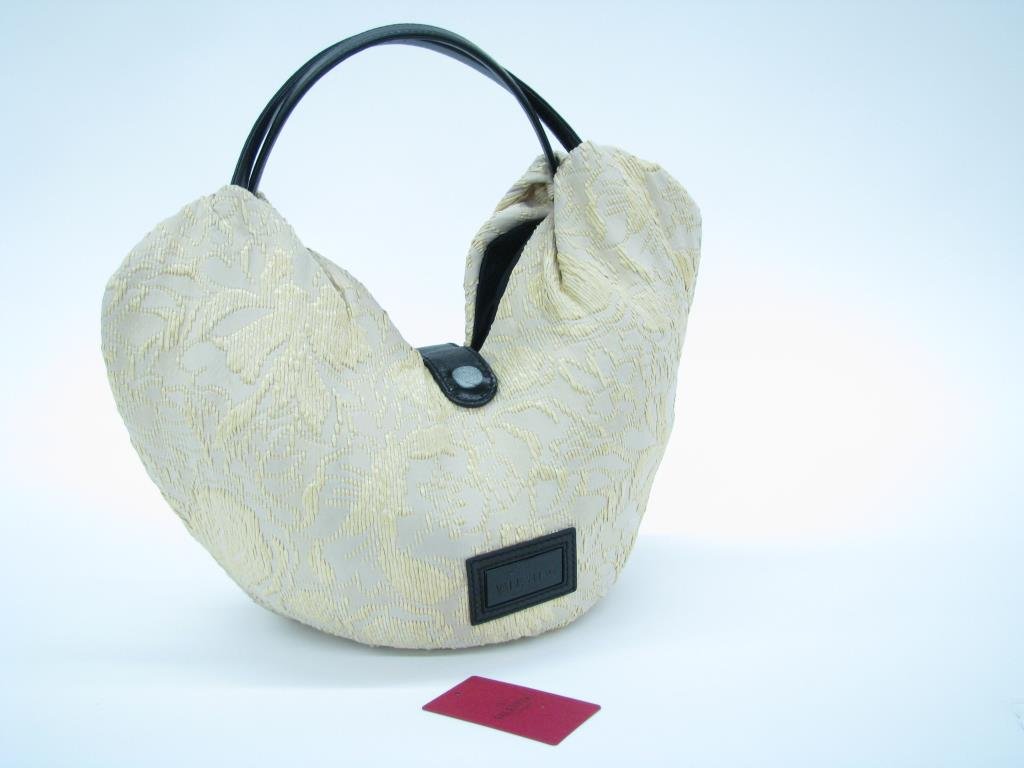 Valentino Garavani Canvas, Straw, Leather Hobo Bag: Valentino Garavani canvas, straw & black leather oversized hobo bag. Two leather top handles, large black leather bow accent, no hardware, magnetic button closure. Logo tag on front. Interior lined in