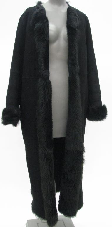 DKNY Black Sheep Skin Shearling Full Length Coat: DKNY Signature black sheep skin shearling full length coat with two slant front pockets. Size Small