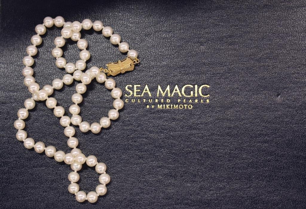 Mikimoto Sea Magic 18" Strand of Pearls: Sea Magic by Mikimoto 18" strand of seventy two individually knotted cultured pearls. Each pearl measures approximately 6.0 mm in size. 14K yellow gold fish hook style clasp. Includes original case an