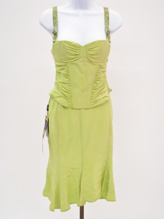 Versace Lime Green Two Piece Outfit: Versace Lime Green Two Piece Outfit consisting of: Bustier style halter top with adjustable crystal encrusted straps and matching skit with zip back closure. Both NWT size 38 (4)