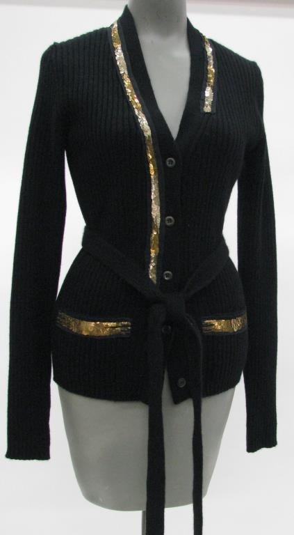 Prada Black Cashmere Cardigan: Prada black cashmere cardigan with gold sequin accents at neck line and two front pockets. Five buttons down front with thin belt at waist. NWT $1355 Size 40