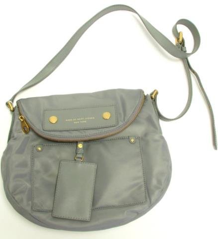 Marc by Marc Jacobs Cross Body Bag: Marc by Marc Jacobs "Preppy Nylon Natasha" cross body bag. Adjustable shoulder strap with gold tone hardware. Zip top closure with fold over magnetic clasp. Exterior pocket and luggage tag. Interior i