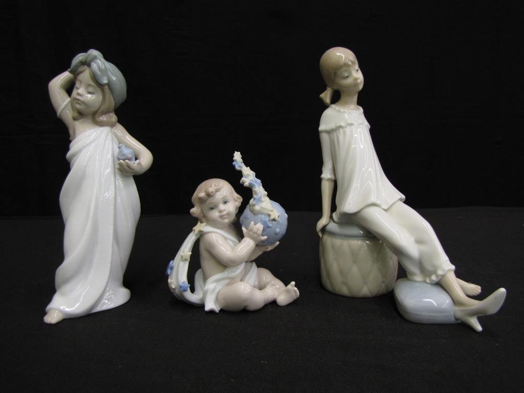 Three Lladro Porcelain Figures: Three Lladro Porcelain Figures, including #6799 "Just Like New" (a girl with perfume bottle), seated baby with stars, seated girl with pigtails, all signed, 4 1/4" to 7 1/2"