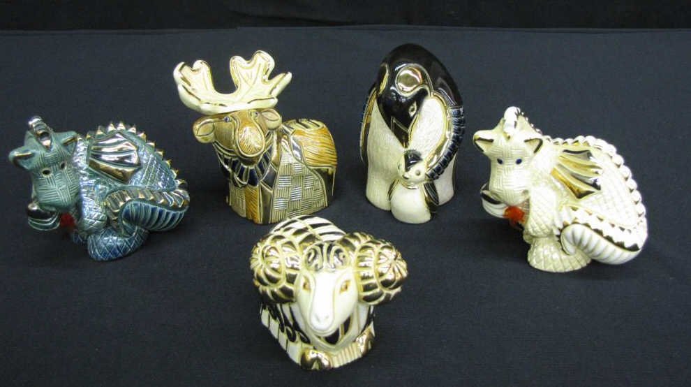 Group of Five Artesania Rinconada Figurines: Group of Five Artesania Rinconada Figurines including: two dragons with flame decoration, one big horn sheep, one moose and one penguin with baby, hand carved, gold trimmed, all signed, 2 3/4-4" tall
