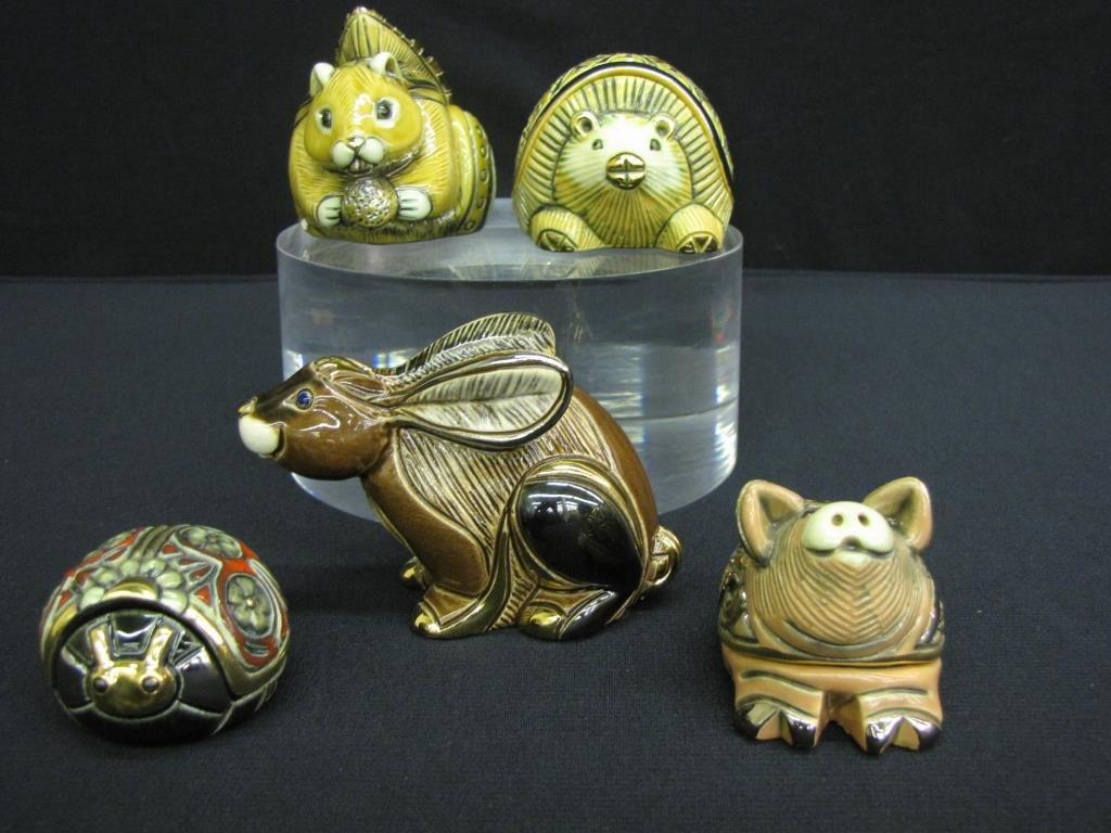 Group of Five Artesania Rinconada Figurines: Group of Five Artesania Rinconada Figurines including: squirrel and hedgehog keepsake boxes with ceramic miniatures, lady bug and pig keepsake boxes with pendants, and a hare, hand carved, all gold tr