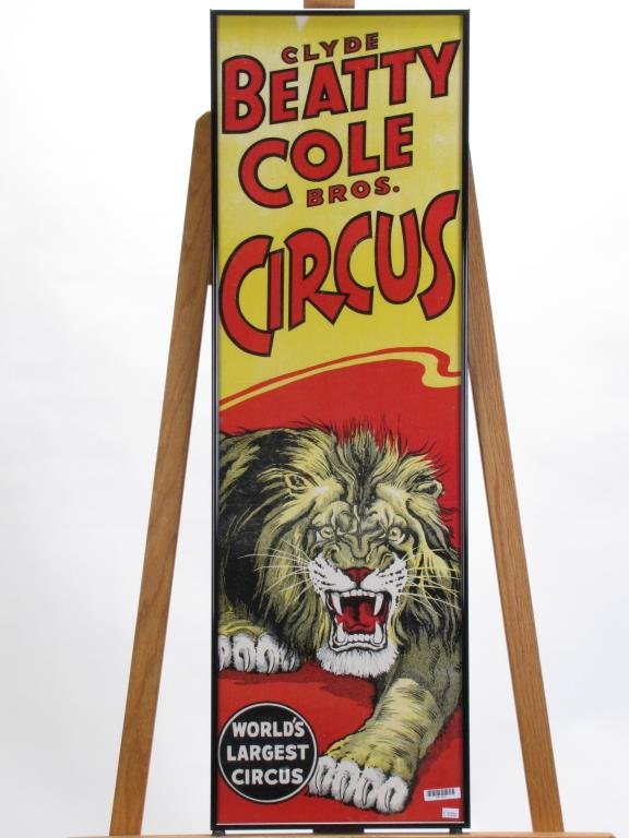 Vintage Clyde Beatty and Cole Bros. Circus Poster: Vintage Clyde Beatty and Cole Bros. Circus Poster, "World's Largest Circus", depicting angry lion, framed under glass, 39" x 12" condition, four areas of fold creasing, minor creasing and fading