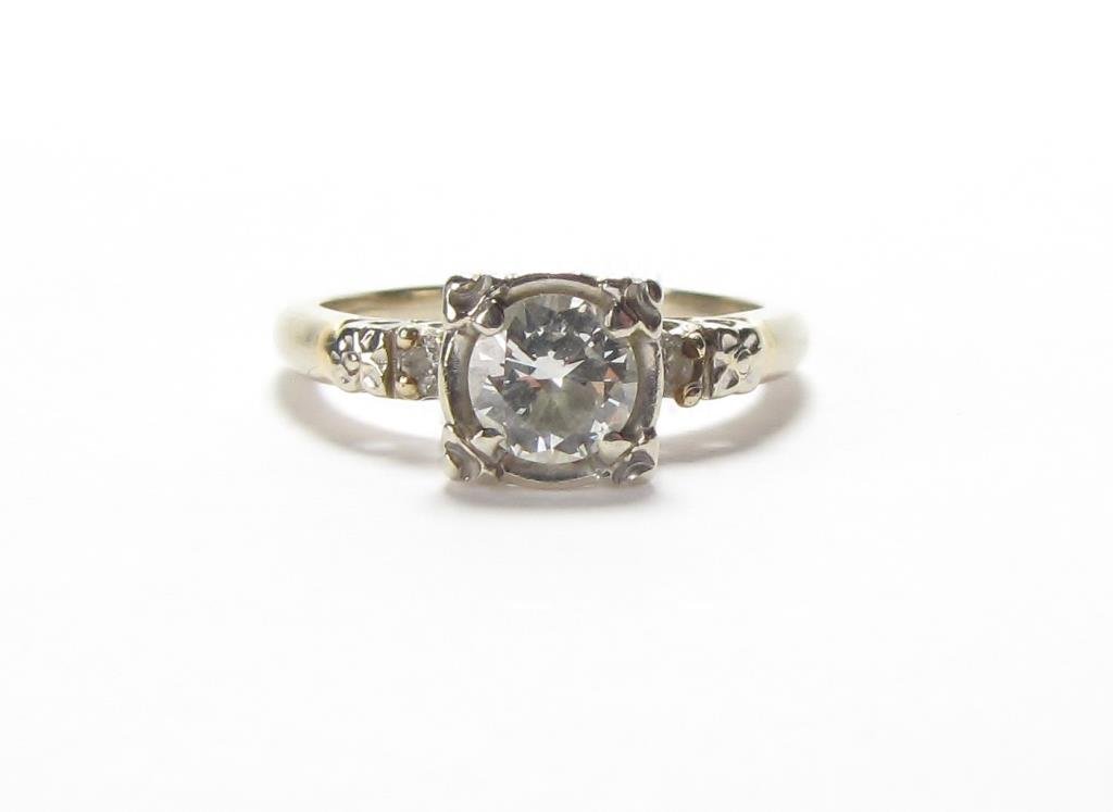 Vintage Gold Diamond Engagement Ring: A vintage yellow gold engagement ring with approximately .45ct round white center diamond and to round accent diamonds in white gold mounting, size 6, 1.9dwt